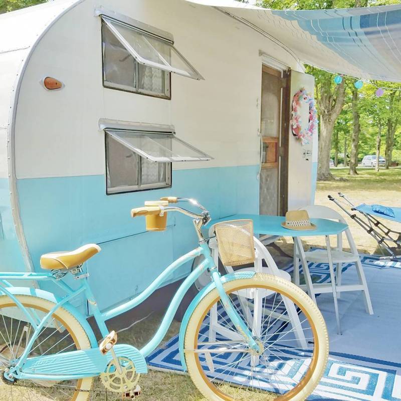 Vintage camper and turquoise bike perfection!